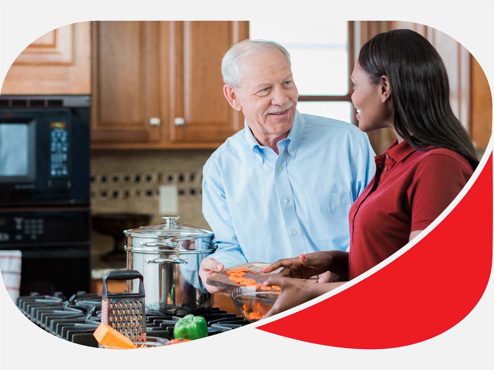 Aging man and Care Professional smile and prepare food together